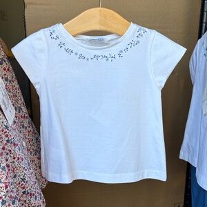 Charming White Kids Tee with Blue Floral Design